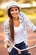 young woman riding a bicycle outdoors