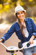 pretty woman with bike and binoculars at park