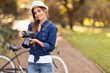 young female photographer with camera outdoors