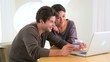 Chinese woman excitedly shopping online with boyfriend