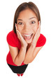 Photo: Joyful excited surprised young woman isolated Joyful excited surprised young woman isolated