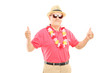 Photo: Happy mature man with hat and sunglasses giving thumbs up Happy mature man with hat and sunglasses giving thumbs up