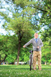 Foto: Mature man pushing a bicycle Mature man pushing a bicycle