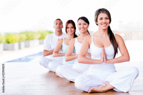 Photo: Group of people doing yoga Group of people doing yoga
