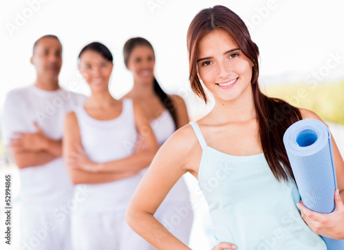 Photo: Woman in a yoga class Woman in a yoga class