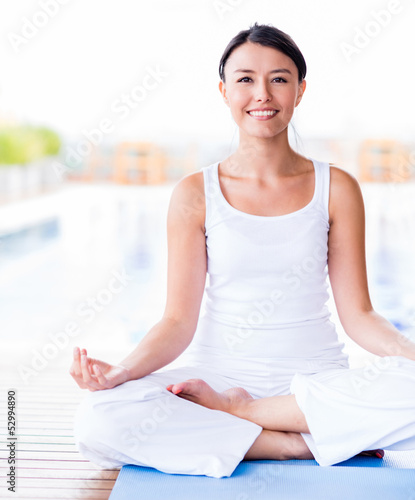 Photo: Woman practicing yoga Woman practicing yoga