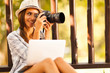female photographer taking pictures at the park