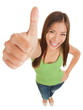 Photo: Fun portrait of a woman giving a thumbs up Fun portrait of a woman giving a thumbs up