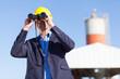 industrial manager with binoculars