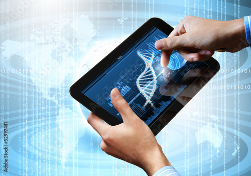Photo: Dna strand On The Tablet Screen Dna strand On The Tablet Screen