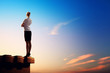 Businesswoman on top of building