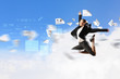 businesswoman in black suit jumping