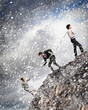 Three business people pulling rope