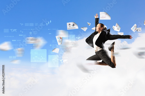 Photo: businesswoman in black suit jumping businesswoman in black suit jumping