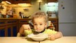 boy eats soup itself