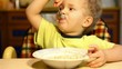 boy eats soup itself