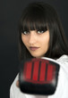 karateka asian girl on black background studio shot