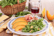 Photo: plate of fresh salad with melon,ham and lettuce plate of fresh salad with melon,ham and lettuce