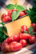 Vintage mug full of fresh cherry tomatoes