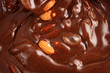Photo: Pouring hot melted chocolate and almond nuts Pouring hot melted chocolate and almond nuts