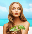 woman with green leaf