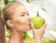 woman smelling apple