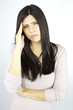 Woman with headache looking