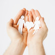 Photo: man hands with paper men man hands with paper men