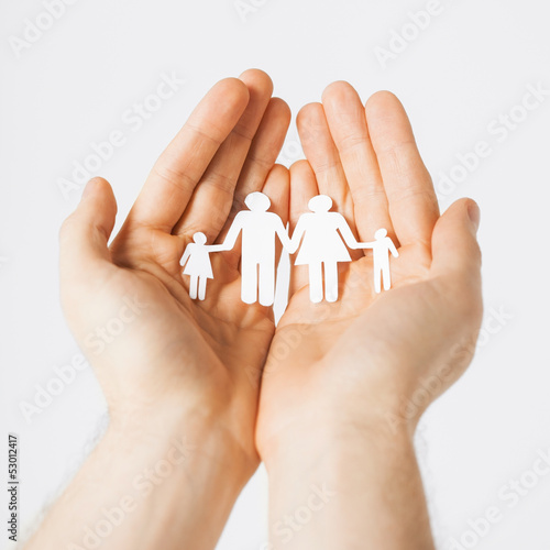 Photo: man hands with paper men man hands with paper men