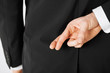 Photo: man with crossed fingers man with crossed fingers