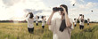 Multiplied girl looking with binoculars