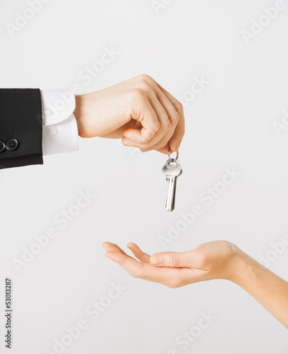 Photo: man and woman with house keys man and woman with house keys