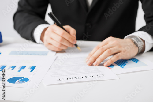 Photo: man with contract man with contract