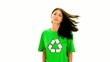 Serious woman wearing green shirt with recycling symbol on it