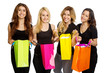 Four girls looking into shopping bags