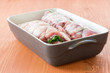 raw meat with green onions twisted to roll