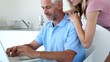 Man typing something on laptop