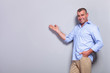 casual old man presents with hand in pocket