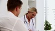 Female doctor talking to a patient