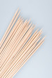 Multiple wooden bamboo skewers laying