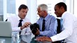 Businessmen looking at camera