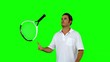 Tennis player throwing his racket