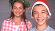 Video: Smiling siblings with christmas hat Smiling siblings with christmas hat