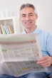 Mature Man Reading Newspaper