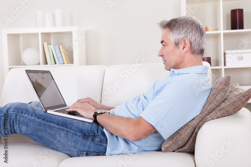 Photo: Mature Man Using Laptop Mature Man Using Laptop