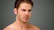 Angry man looking at the camera on grey background