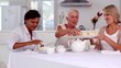 Video: Mature friends having cup cakes Mature friends having cup cakes