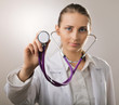 Close-up of female doctor using stethoscope