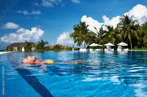 Photo: Woman at poolside Woman at poolside