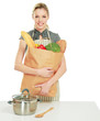 Photo: Woman in apron holding grocery bag Woman in apron holding grocery bag